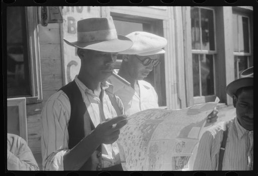 Photo of migrants with a map